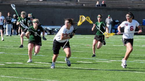 Co-captain Natalie Curtis, shown here in earlier action, led a group of three seniors to score for the Harvard women’s lacrosse team in a 14-11 victory over Boston College last night, posting three goals and an assist to put the final touches on a stellar
