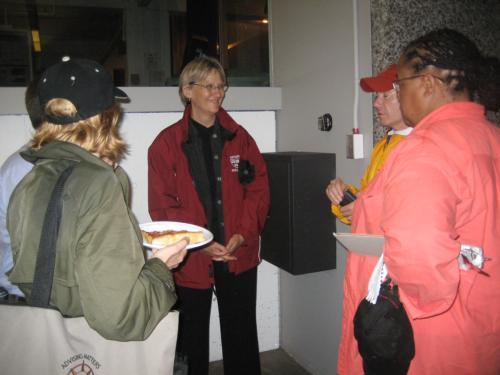 University President Drew G. Faust talks with university administrators, including Dean of the College Evelynn M. Hammonds, during Saturday night's electrical surge.