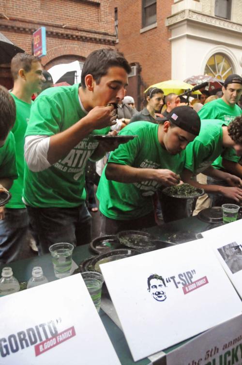 Tyler D. Sipprelle ‘10 (“T. Sip”) gulps down handfuls of spinach at the fifth annual b.good “garlicky-greens” eating contest on Saturday.