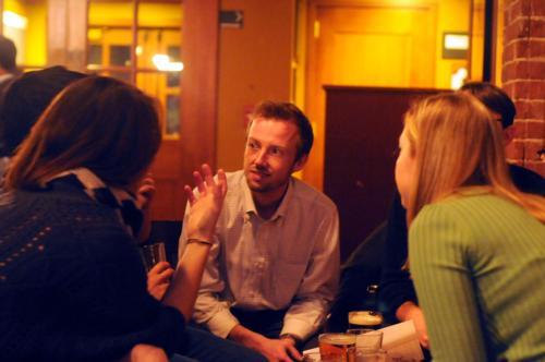 Harvard graduate students participate in “Green Trivia” at the Queen’s Head Pub yesterday.