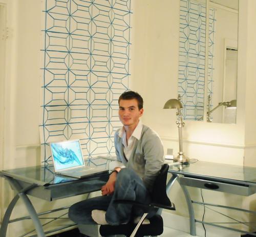 Roger C. Batt ’10 perches on his sleek, non-standard issue dorm desk. We’re jealous.