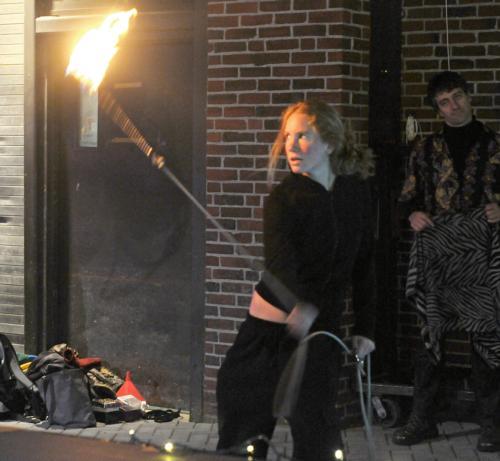 A firedancer performs at the “Dare to Wear” Celebrity Fashion Show in Harvard Square yesterday.