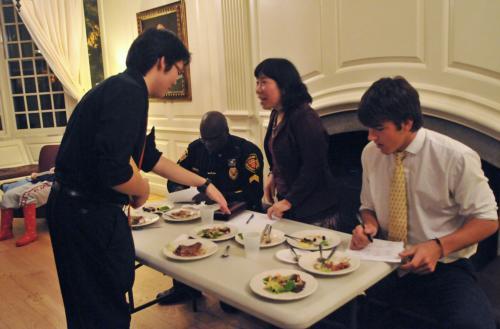 A student presents a plate to the judges at the Chinese Student Association’s annual Iron Chef competition on Saturday. The CSA took on members of the Harvard African Student Association in the cooking challenge.