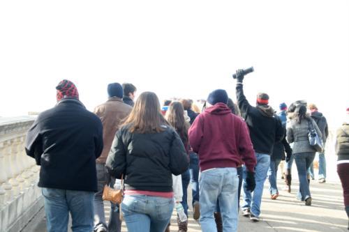 Mather students stream across Weeks Footbridge to the tailgate, which began at ten and lasted until noon. It continued for another two hours following the Game. 