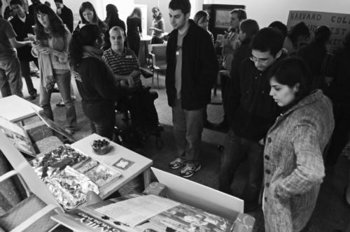 Students sample foods from many different religious traditions at The Harvard Interfaith Council holiday event in Ticknor Lounge last night. 