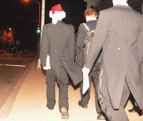 A member of the Glee Club in the holiday spirit walks to the Flores-McLeod party, continuing a longstanding tradition that the Glee Club serenade the winners.