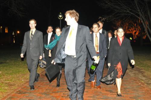 Members of the Election Commission, headed by Steven T. Cupps ‘09, center, walked to the Flores-McLeod party to personally announce the results and congratulate the winning ticket.
