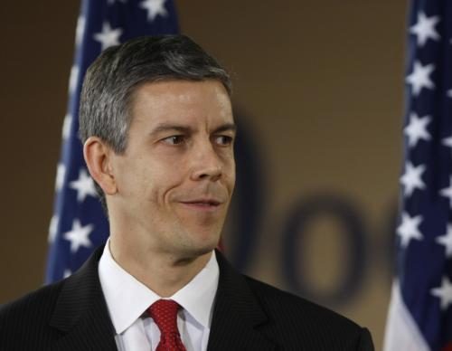 Education Secretary-designate Arne Duncan looks on as President-elect Barack Obama announces the pick at a press conference Tuesday at the Dodge Renaissance Academy in Chicago.