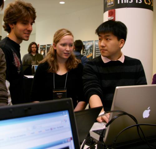 Dylan K. Lake ‘11, Paige E. Martin ‘11, and Xiaoqi Zhu ‘11 present their project at the CS50 Fair Friday afternoon. 