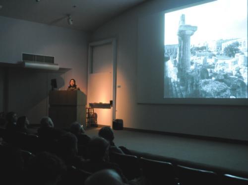 Danielle Carrabino, a lecturer at Brandeis, speaks about the art, myth, and culture of Syracuse as a part of a series of lectures on cities and their architectural histories at the Sackler Museum. As a port city, Syracuse brought together Roman, Muslim, S