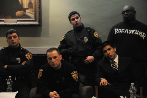 Harvard police officers attend an event to discuss racial profiling and police brutality.
