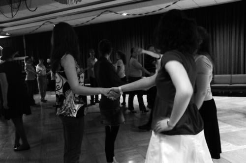 Students pair off to partake in a traditional Ceili dance at the Currier March Party. 