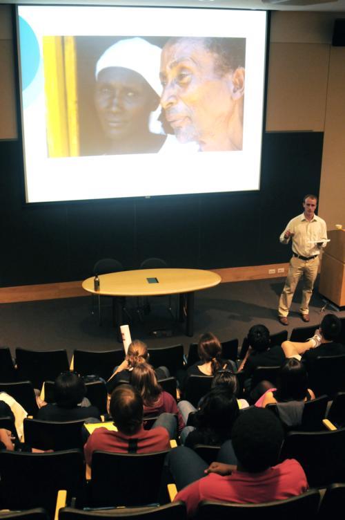 Dr. Matthew Craven, co-founder of Support for International Change, speaks Saturday in the Science Center at “Say Yes to Drugs”, an event sponsored by multiple Harvard student groups.