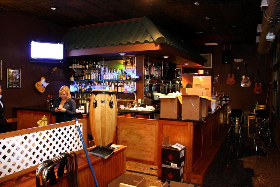 Congas, a new tapas restaurant in Harvard Square, prepares for its grand opening tomorrow. Having recently secured liquor licesnes, Congas bartenders J.D. Acton and Carlos Medina prepare for business later this week. Conga owner Panja Lymswan, also the owner of Spice, recently decided to open Congas, at 1 Eliot street formally Shabu Square.