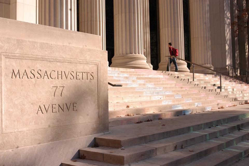 Students leave 77 Massachusetts Avenue, the main address of MIT, yesterday morning. The university is considering increasing its student population.