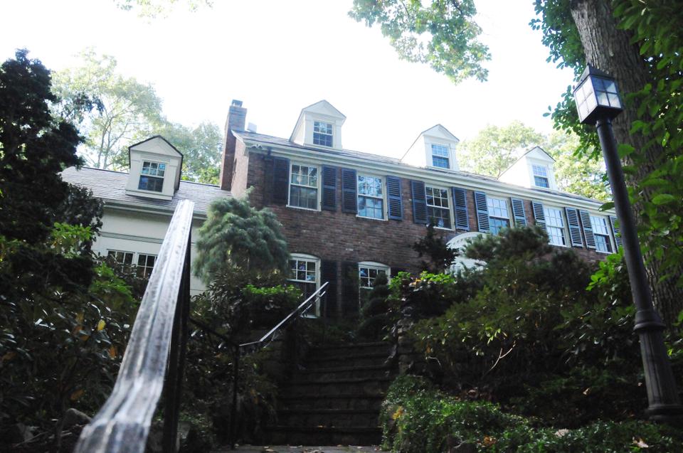 Mankiw's Brick Center Hall Colonial style home was built in 1932 and is packing 3 stories, 6 bedrooms, and 5.5 bathrooms.