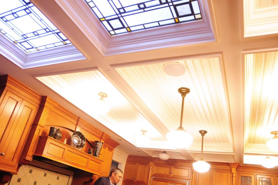With its granite countertops, cherry wood cabinetry, and illuminating skylights, it's no surprise that the Mankiw family spends most of its time in the kitchen.