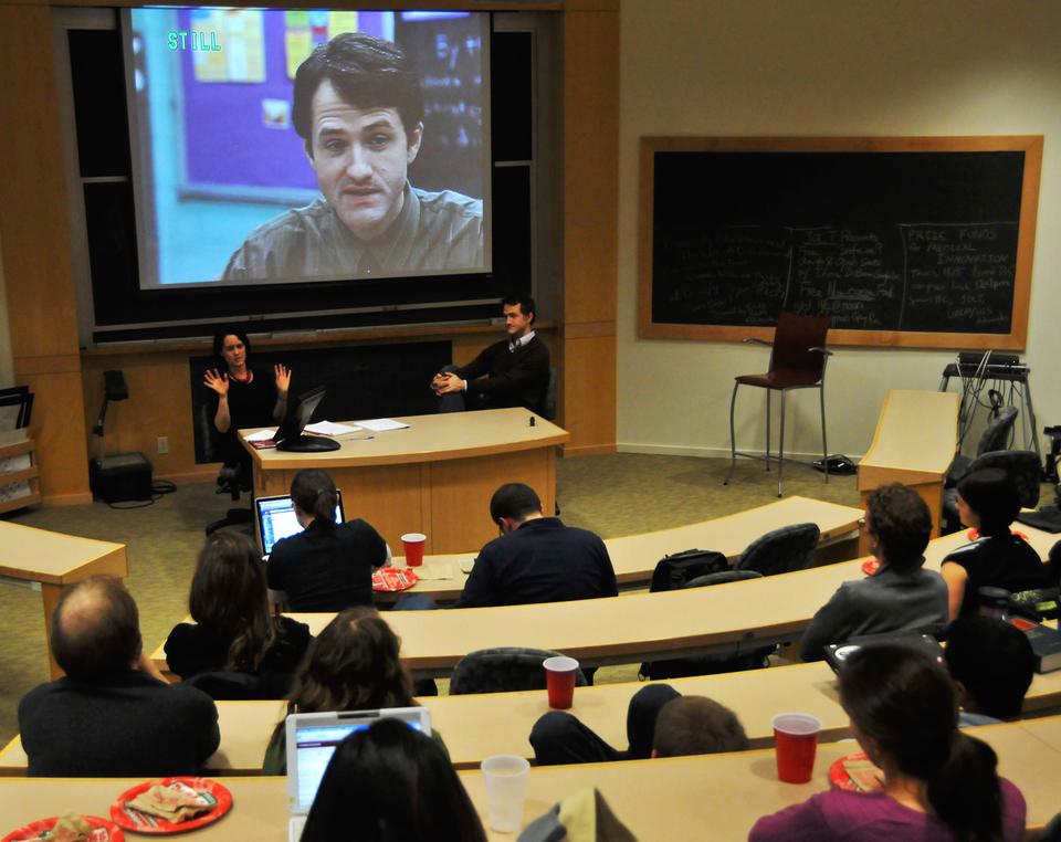 Jim True-Frost, an actor on “The Wire,” and his wife show clips of the program during a discussion on inner city education. 