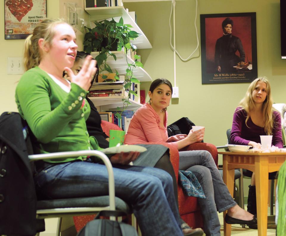 A diverse group of students discuss their defintions of feminism and opinions about gender roles over tacos yesterday in the Women's Center.