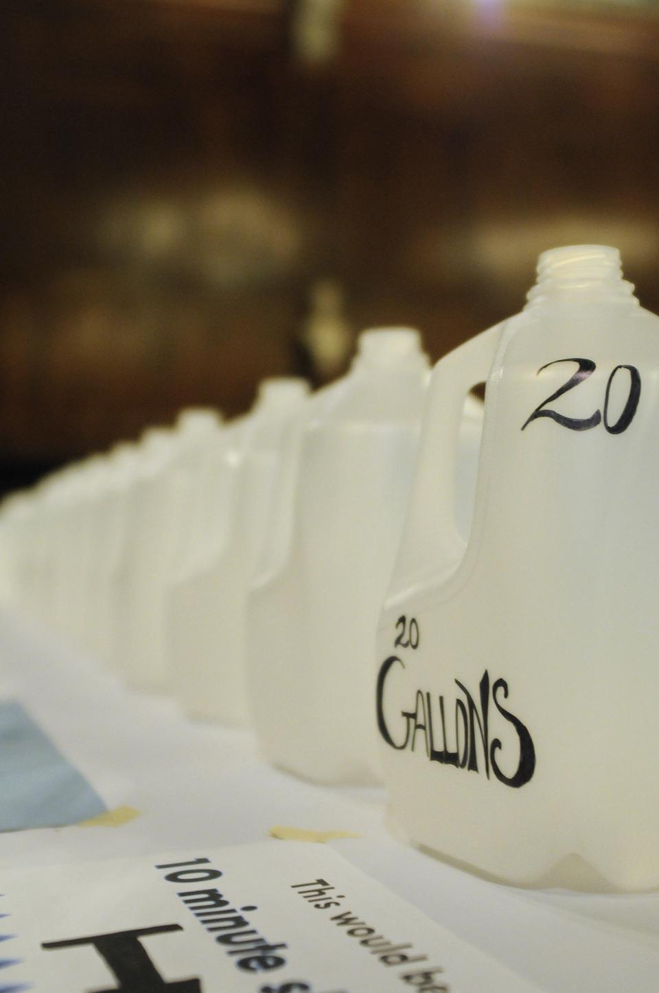 The Freshmen Resource Efficiency Program lined the back tables of Annenburg yesterday with gallon-sized water jugs representing the amount of water used during different shower time lengths. 20 gallons is the amount of water used during a 10 minute shower.