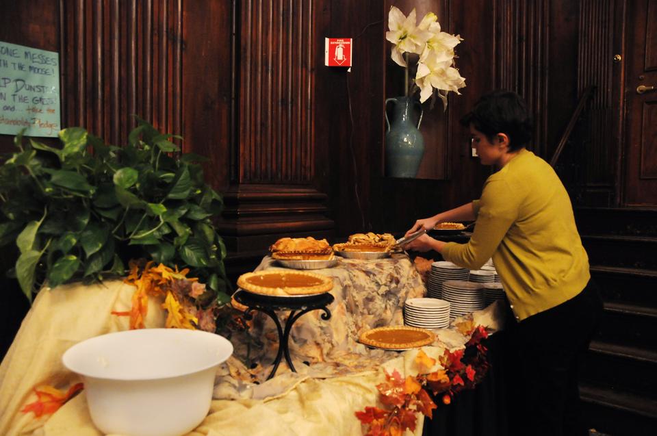Students enjoy the pumpkin and apple pies at the Thanksgiving dinner in Dunster House. 