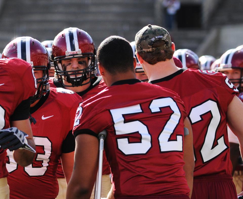 Though they’re most recognizable in their helmets, the men of the Harvard football team got a different sort of hat this season. Though the camouflage caps began with the defensive unit in recognition of its “Do Work” motto, by the end of the season, the whole team was wearing them—in part to honor the members of the Harvard football family serving in the military.
