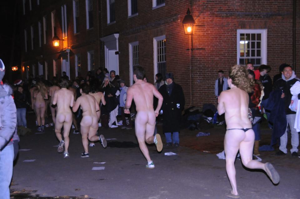 Students kick off finals period with Primal Scream in Harvard Yard by taking a lap around the night scene in various states of undress.