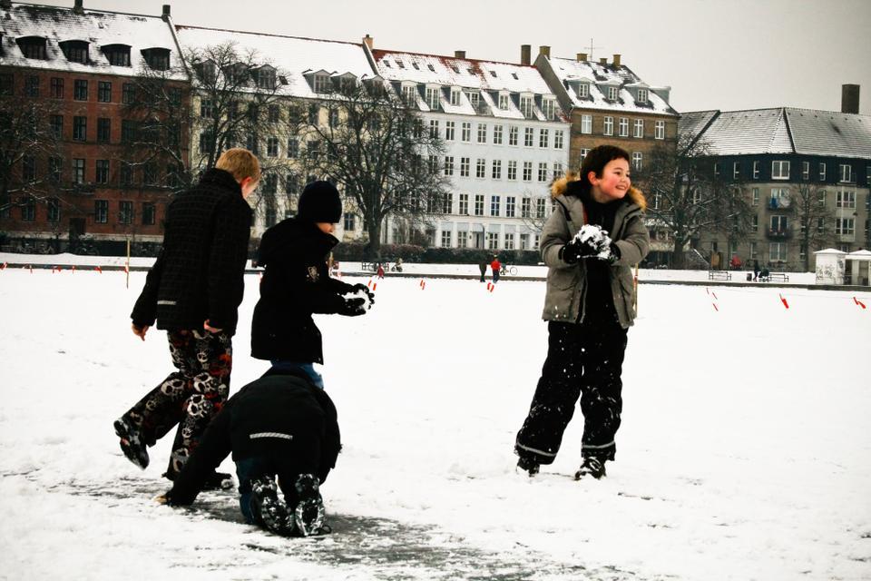Children have a snowball fight in freezing Copenhagen, Denmark. 