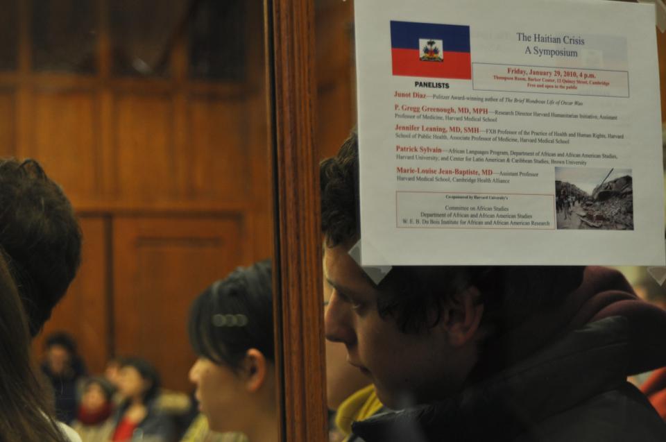 Harvard students and faculty crowd the Thompson Room in the Barker Center last Friday during “The Haitian Crisis: A Symposium.”