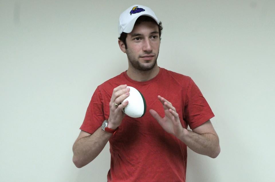 Alex drops his video game controller and picks up a football, if only for a fleeting moment.