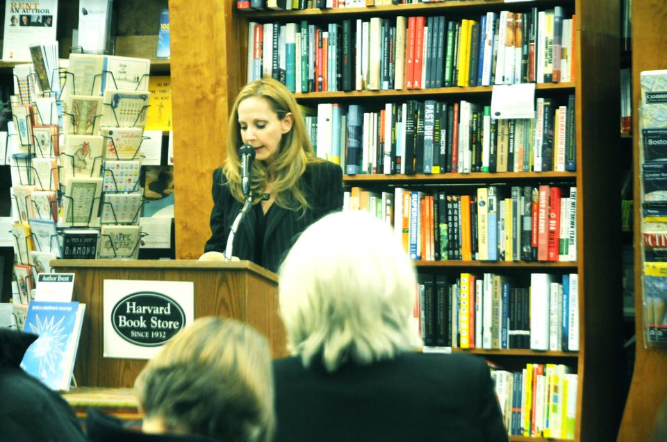 Goldstein speaks amongst the crowded shelves of the Harvard Book Store.