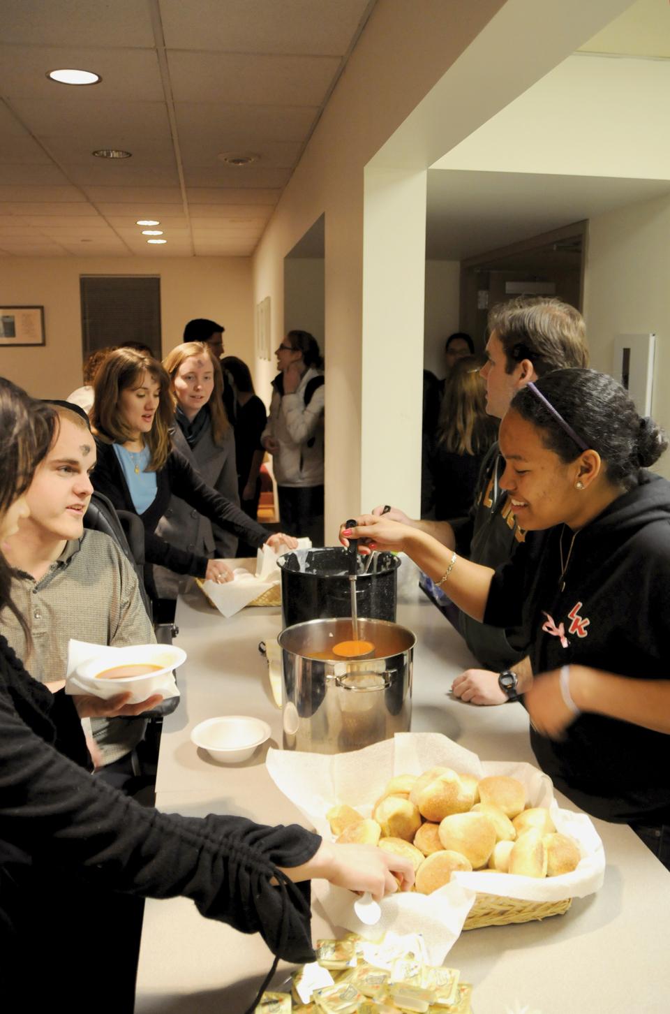 Leaha A Wynn (2013) serving dinner at St. Paul Parish after Ash Wednesday mass.