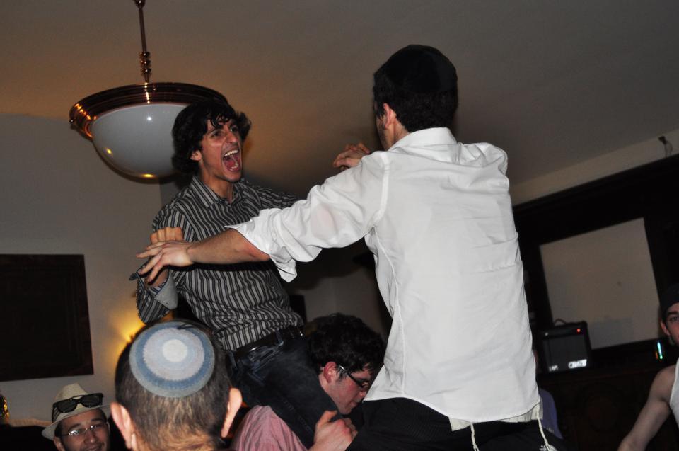 Jacob Khoubian '10 enjoys Harvard Chabad House's Absolut Purim party. A live band played traditional music while guests ate hamantashen and dressed in costume.