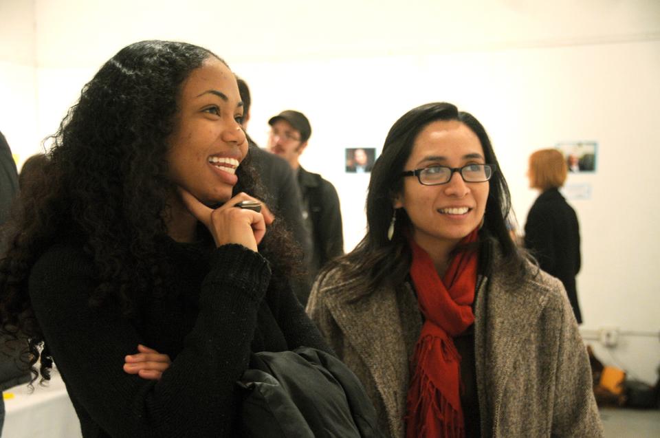 Students gather at the Adams Art Space to celebrate Harvard's first annual Feminist Coming Out Day, where a feminist portrait project displayed the diverse faces of feminists on campus.