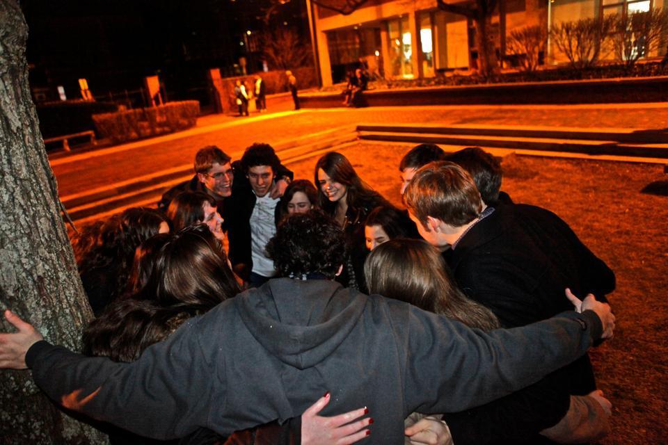 Freshmen build camaraderie through River Run rituals, such as those that this group was performing in Quincy House courtyard last night.
