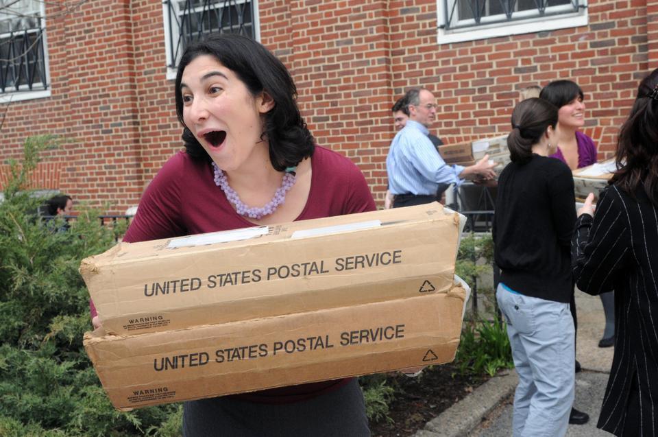 Admissions officer Valerie Beilenson helps load decision letters that will be delivered to applicants for the class of 2014 onto a mail truck outside of the Admissions Office. 6.8% of applicants were granted a spot in the Harvard College Class of 2014.