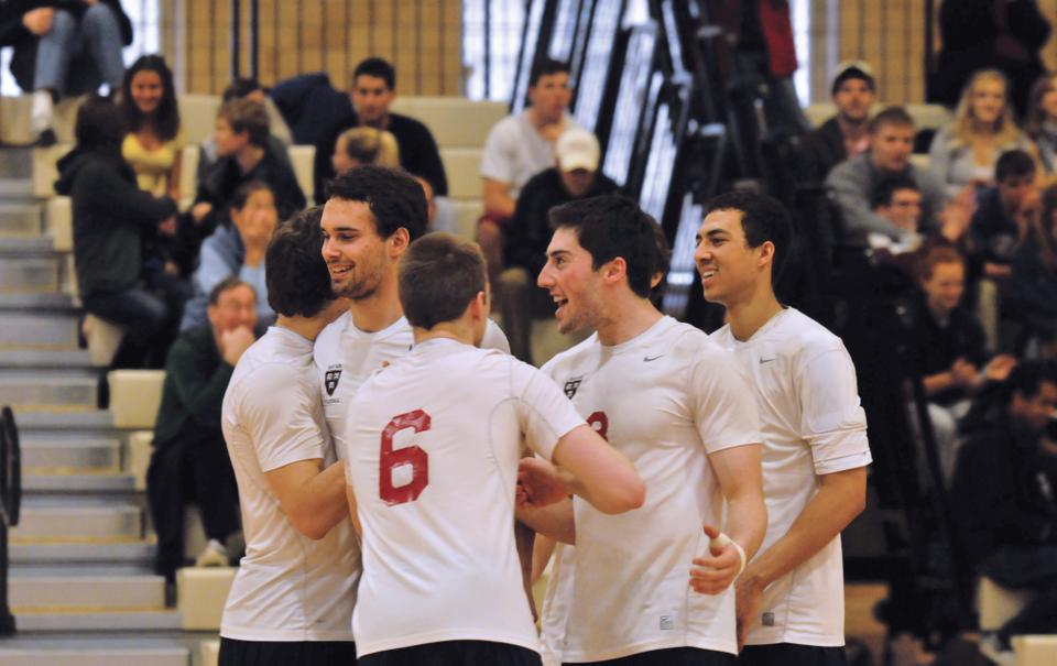 The Men's volleyball team celebrates a set win during the match against NJIT. 