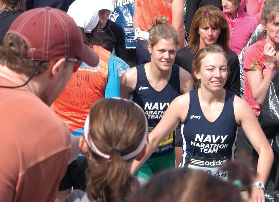 Members of the Naval Academy Marathon Team start the Boston Marathon yesterday morning in Hopkinton, Mass. Over 26,000 runners participated in this year’s race, which spanned over 26 miles and ended in Boston. 
