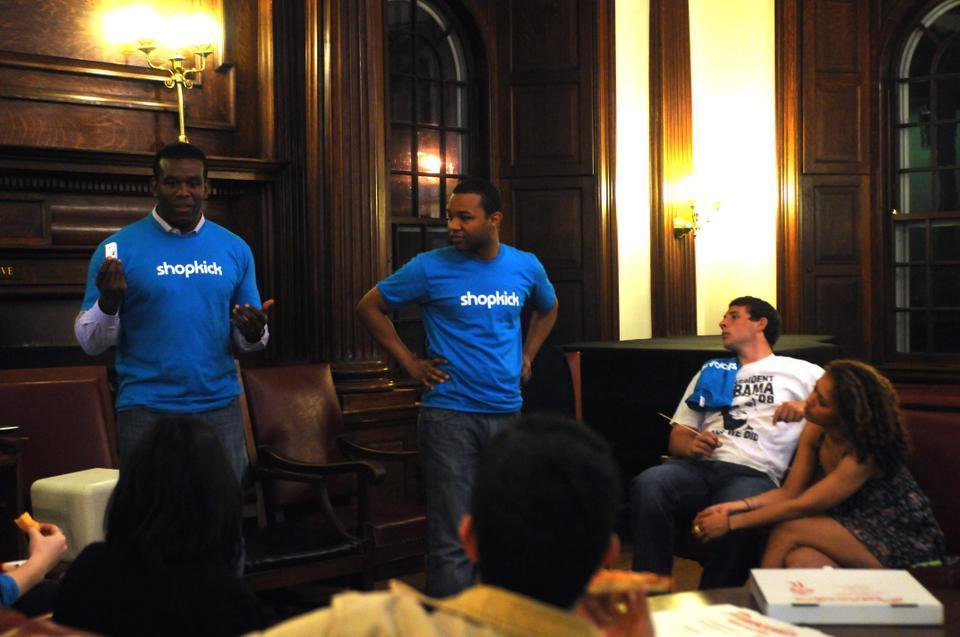 Hakim Thompson and Yohanas Frezgi of Shopkick present Causeworld , a new iPhone application that allows people to easily make donations to charities of their choice by checking in at different locations across the city. The Philips Brooks House, where the event occured last night, is both a check in location and a charity for Causeworld.
