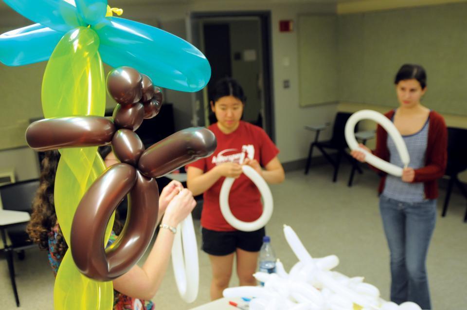 Elizabeth Letein ‘13 and Nancy Chen ‘13 learn how to make balloon animals at Harvard’s brand new charitable clown club, ClassClowns, which met for the first time yesterday evening. 