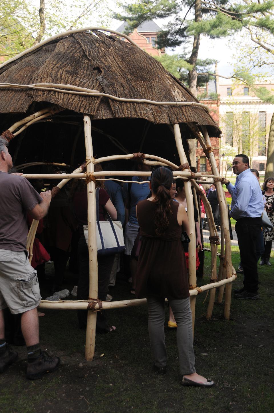 Students explore the wetu, built in honor of the 360th anniversary of the Charter for the Harvard Indian College, after an opening ceremony yesterday.