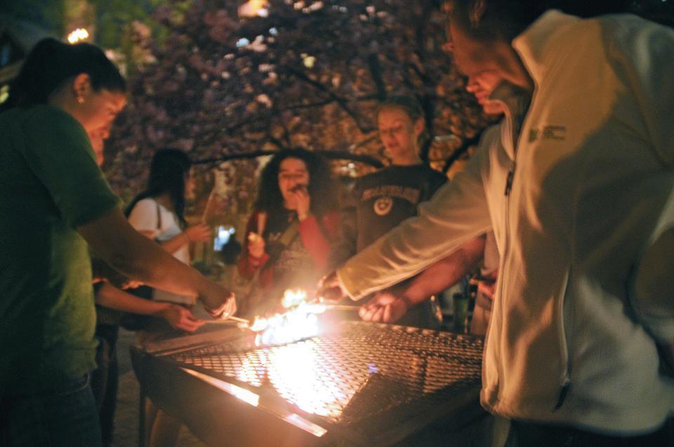 Dunster House residents enjoy s’mores and a screening of Planet Earth in Dunster Court Yard yesterday in celebration of Earth Day.