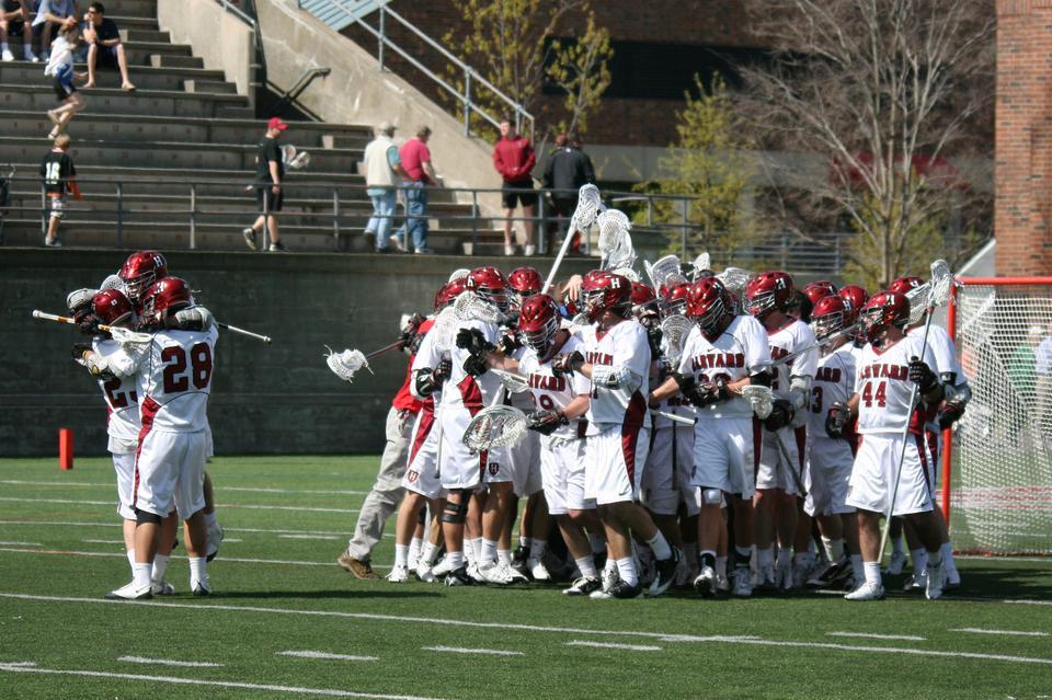 Harvard men's lacrosse celebrates its 11-8 victory over No. 6 Princeton. The Crimson's win last Saturday marked the first time since 1990 that the squad has topped the Tigers and came at an opportune time, with Harvard struggling to make the new Ivy League postseason tournament.