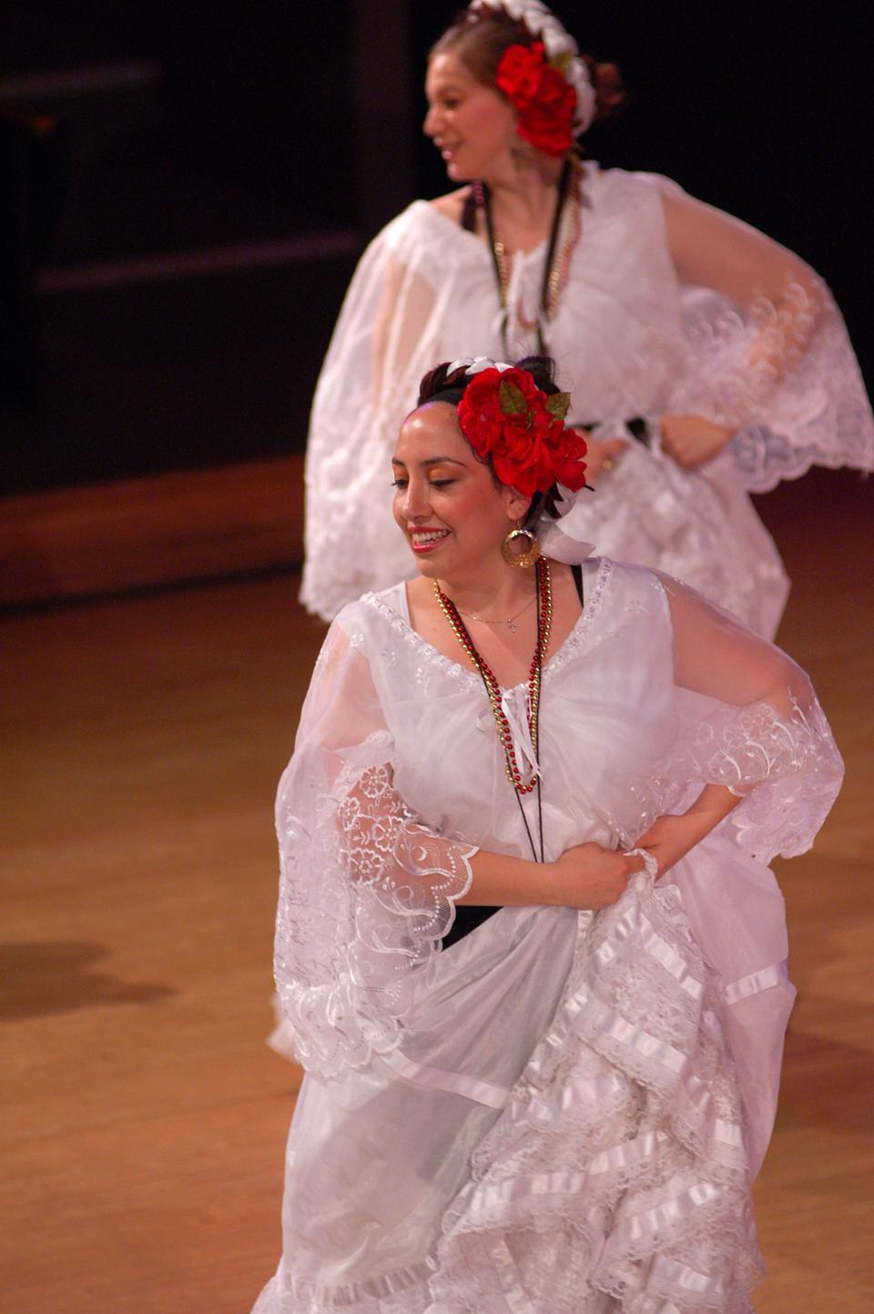 Marisol Ramirez '10 (back) and Diana Robles '10 (front), members of Harvard's Ballet Folklórico de Aztlán, perform during Presencia Latina's ¡Celebra, Harvard! on Friday, April 23, 2010. (CORRECTION: An earlier version of the caption for this photograph misidentified the depicted individuals. The caption has been changed to reflect this error.)