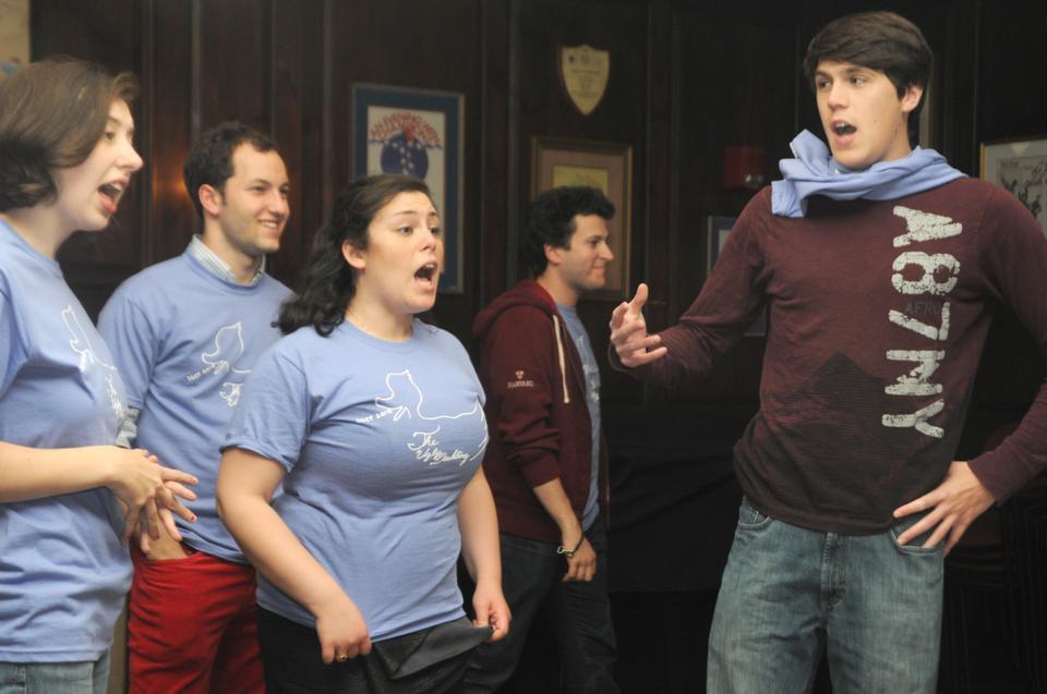 Cast members from the Sunken Garden Children’s Theater sing during a midnight rehearsal.