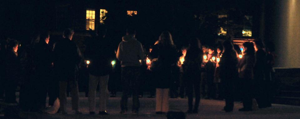 Take Back the Night holds a candlelight vigil to raise awareness for sexual assault victims across campuses yesterday evening on the steps of the Memorial Church. Harvard is only one of 10 colleges across America to hold such a vigil. 