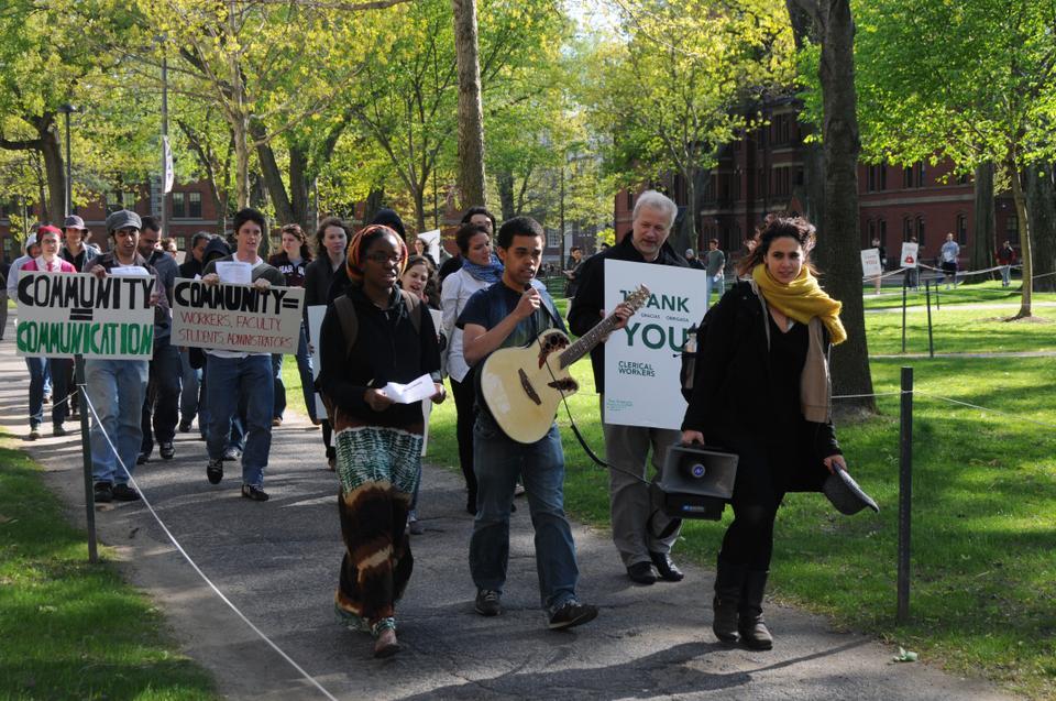 Christopher A. Johnson-Roberson ‘11 sings for more communication with workers in the Harvard community as he leads a procession of 30 across the Yard. 