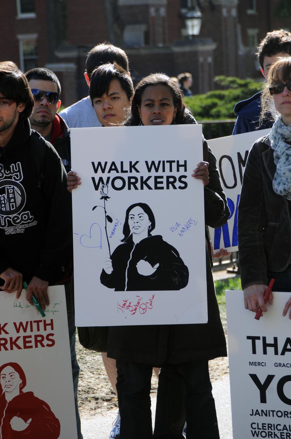 Member of the Harvard Student Labor Action Movement lead a group of 30 demonstrators advocating for better treatment of Harvard workers through the Yard yesterday. 