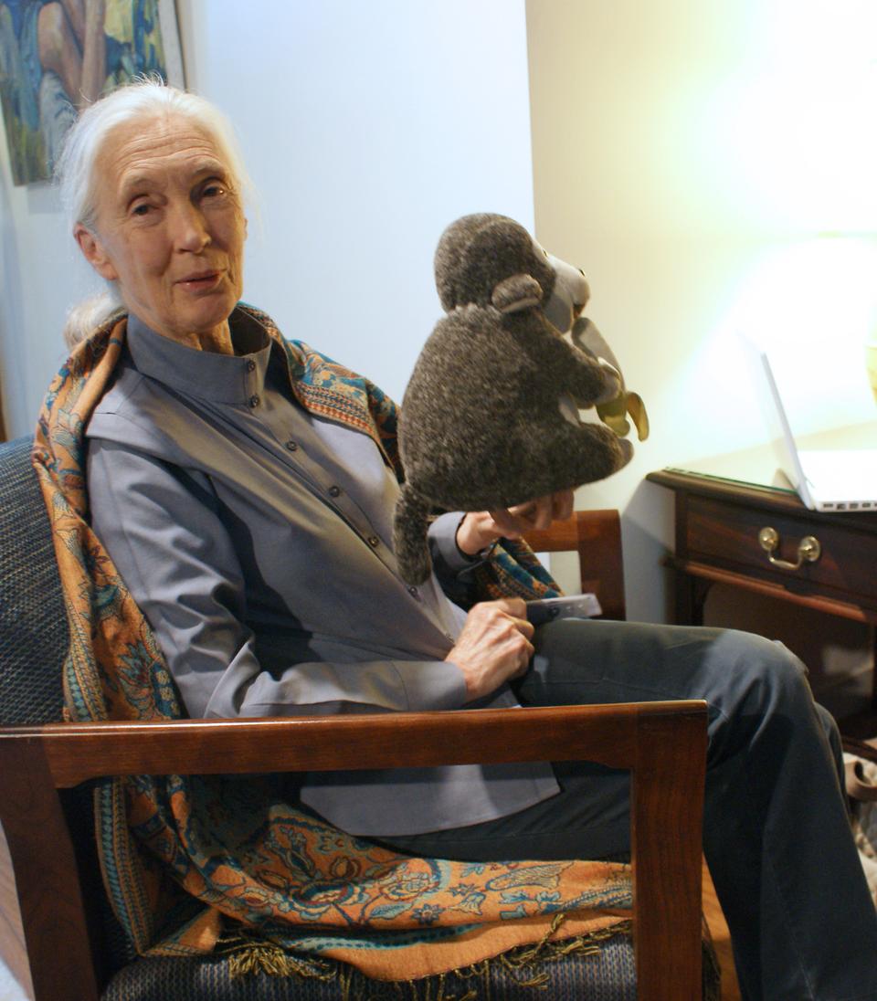 Jane Goodall speaks passionately about her organization Roots and Shoots, while holding the travel worn, unofficial mascot.