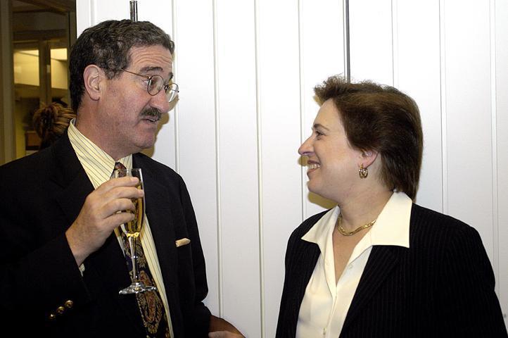 Williston Professor of Law Robert H. Mnookin ’64, left, congratulates newly appointed Harvard Law School Dean Elena Kagan at a champagne reception in this April 2003 file photo. Kagan replaced Robert C. Clark as Dean of the Law School in July 2003.
